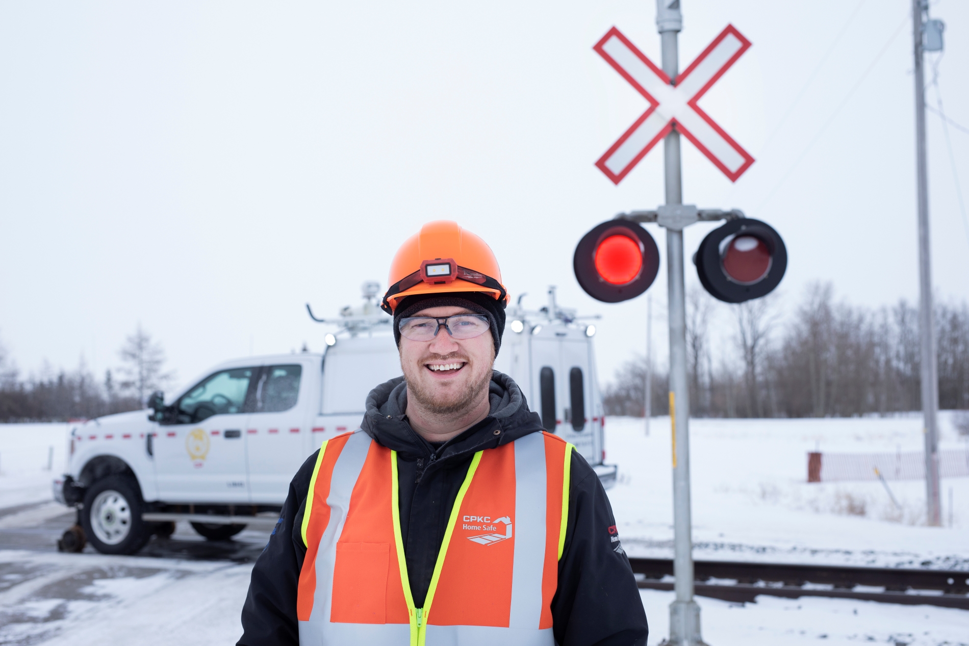 Man wearing protective gear in-front of a work zone